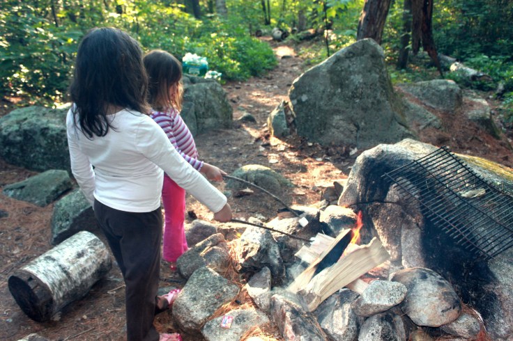 Toasting marshmallows for s'mores