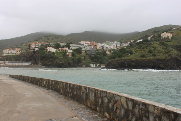 Clouds sit low on the hills above Portbou
